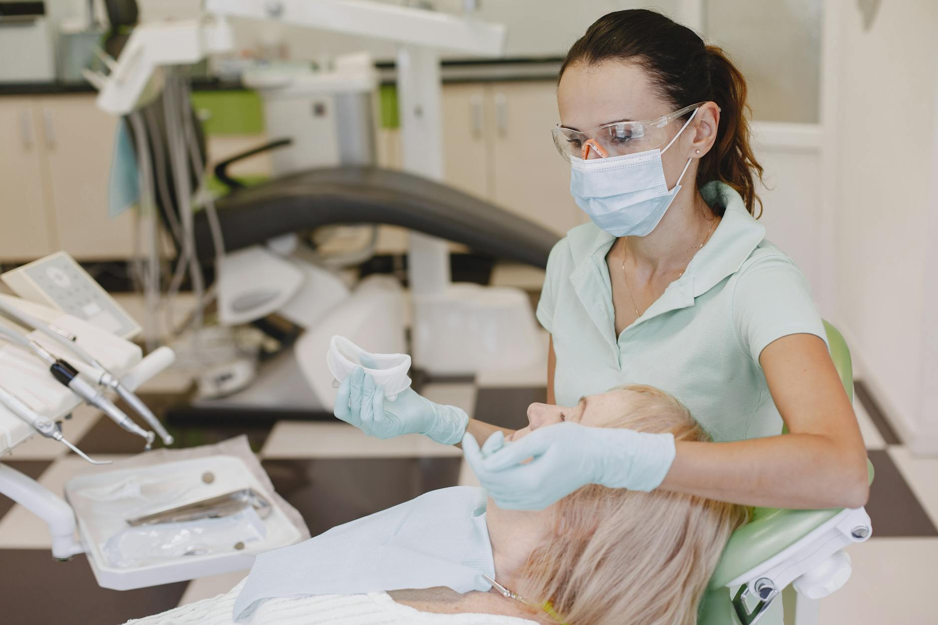 A child holding their mouth in pain, possibly due to a dental injury.
