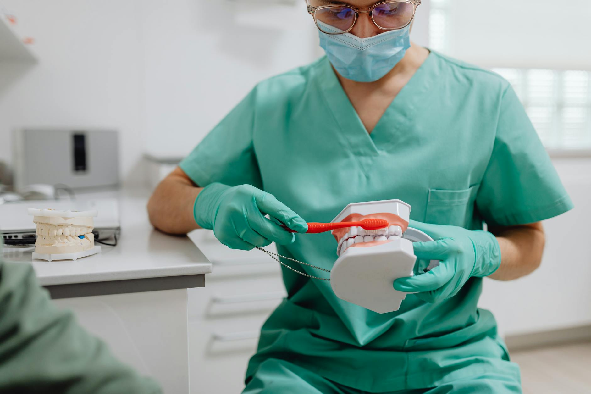 A dentist examining a patient's mouth with dental tools