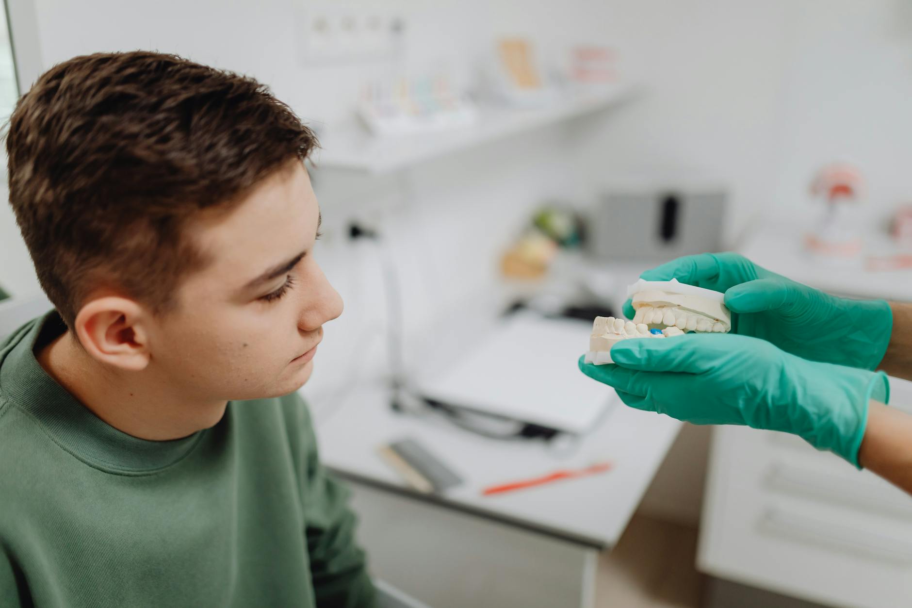 Dentist preparing for a tooth extraction procedure.