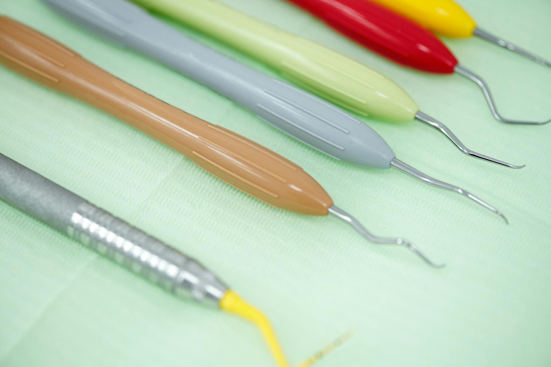 Dentist examining a patient's mouth for signs of spreading dental infection.