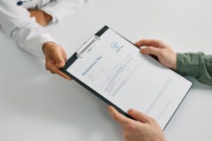 Close-up of a person's mouth showing a loose tooth from trauma.