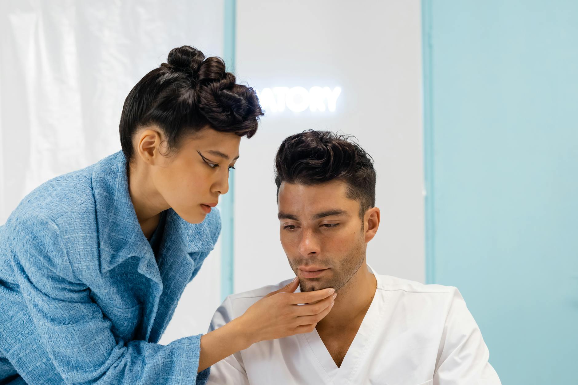 Dentist examining a patient's mouth for dental injuries.