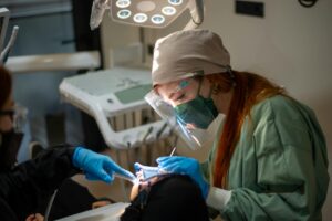 Dentist working on a patient's missing tooth